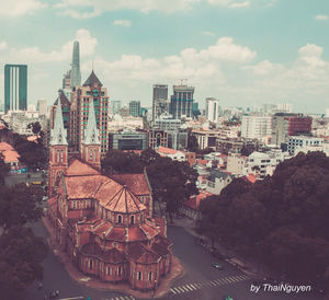 View of cityscape against cloudy sky