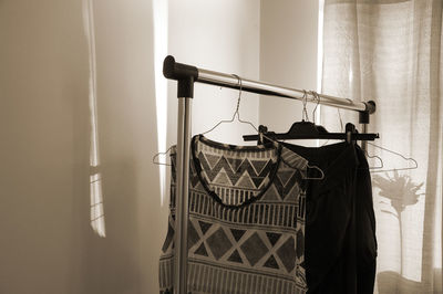 Close-up of clothes hanging on rack