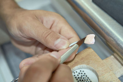 Close-up of person holding cigarette