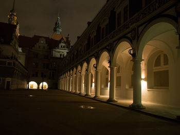 Illuminated city against sky at night