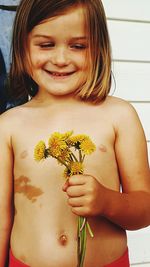 Smiling girl holding flowers