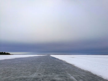 Scenic view of sea against sky during winter