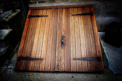 High angle view of closed door of old house