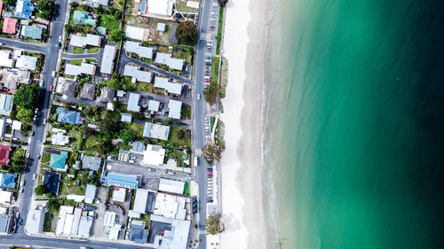 High angle view of buildings and sea in city