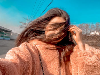 Portrait of woman standing outdoors