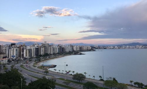 High angle view of city and buildings at sunset