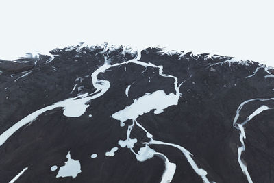 Shadow of tree on snow covered land