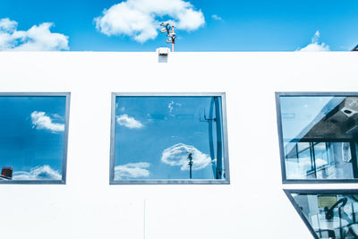 Built structure against blue sky and clouds