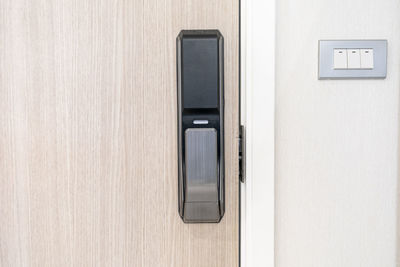 Close-up of telephone booth on wall