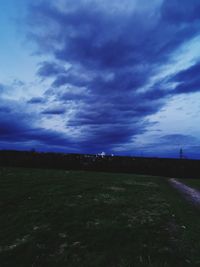 Scenic view of field against sky at dusk