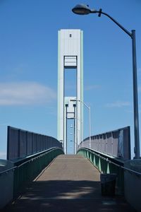 Footbridge against sky