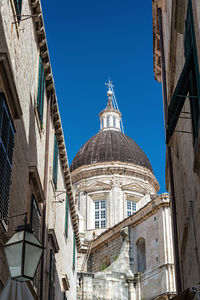 Low angle view of buildings against clear sky