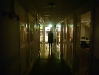 Woman walking in corridor