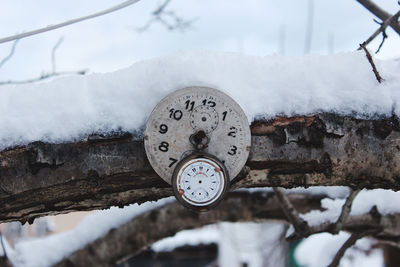 Close-up of snow on rusty metal during winter