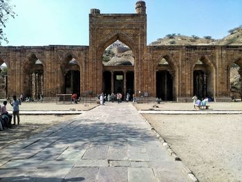 People in front of historical building