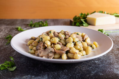 Creamy porcini mushroom gnocchi. typical dish of italian cuisine, suitable for a vegetarian diet