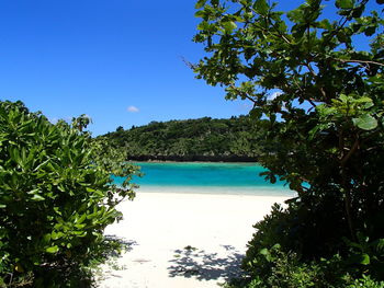 Scenic view of sea against clear blue sky