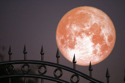 Low angle view of moon against sky at night