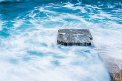 High angle view of rocks in sea