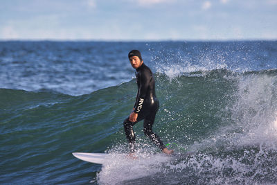 Full length of young man against sea