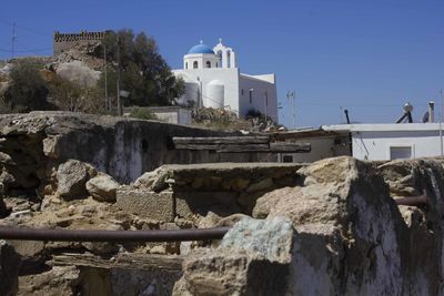 Panoramic shot of buildings against clear sky