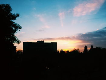 Silhouette of buildings at sunset