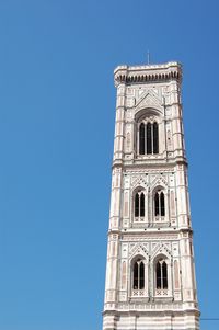 Low angle view of building against clear blue sky