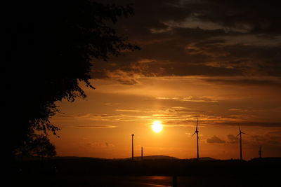 Scenic view of silhouette trees against sky during sunset