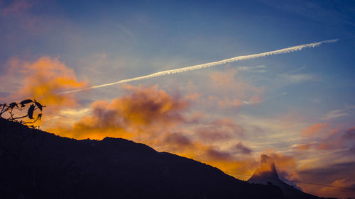 Low angle view of vapor trails in sky