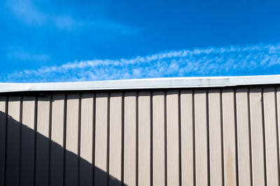 Roof of building against cloudy sky