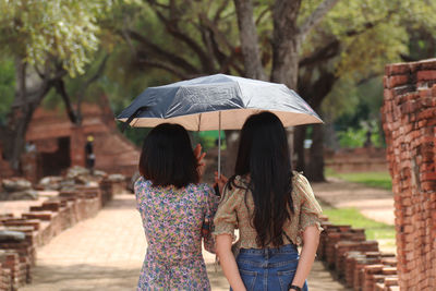 A girl with an umbrella on a sunny day