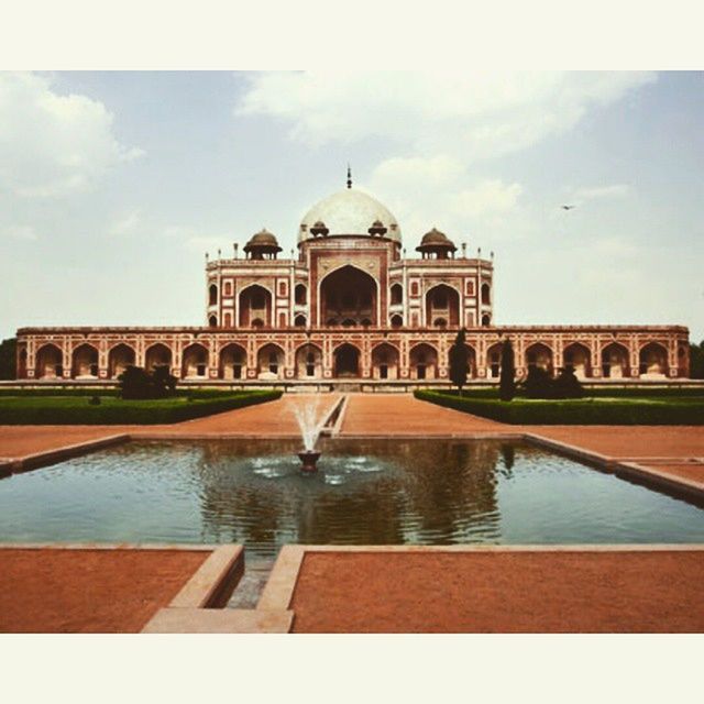 architecture, built structure, building exterior, dome, sky, arch, water, famous place, travel destinations, reflection, place of worship, travel, religion, tourism, history, facade, spirituality, cloud - sky, international landmark, cathedral