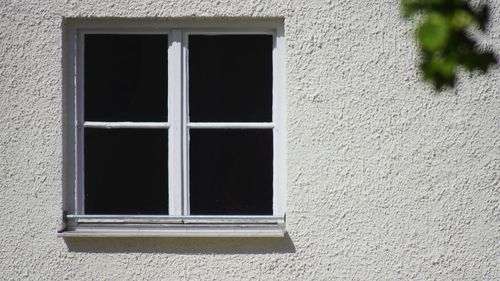 Close-up of window on wall of building