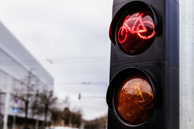 Illuminated road sign in city