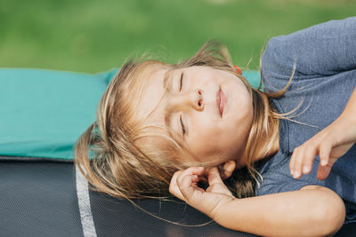 Girl lying on bench