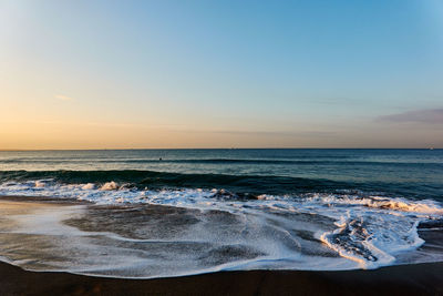 Scenic view of sea against sky during sunrise