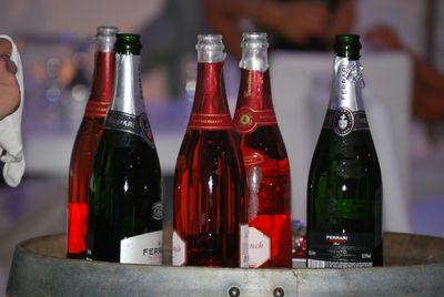 Close-up of wine bottles on table