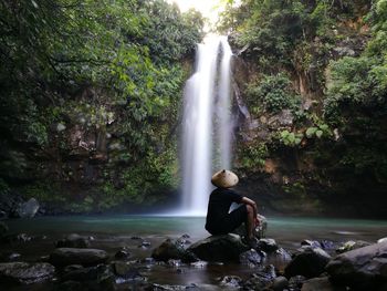 Tourist at waterfall