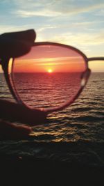 Close-up of sea against sky during sunset