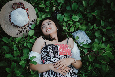 Full length of smiling girl with plants