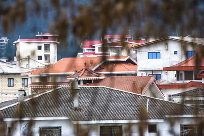 View of houses in city during winter