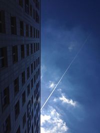 Low angle view of vapor trail in blue sky