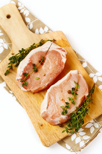 High angle view of fish on cutting board
