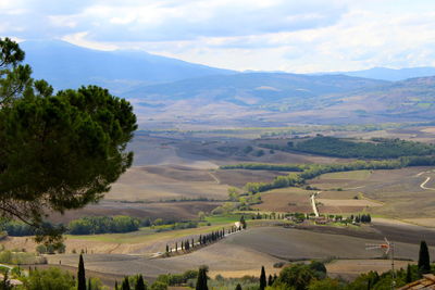 Scenic view of landscape and mountains against sky