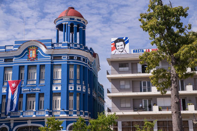 Low angle view of buildings against blue sky