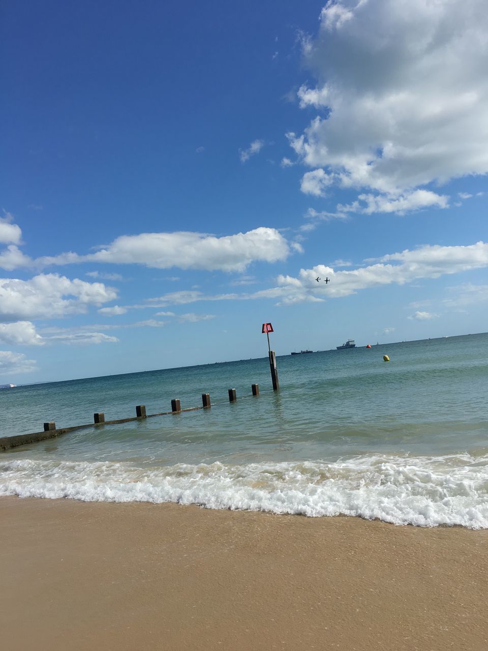 SCENIC VIEW OF BEACH BY SEA AGAINST SKY