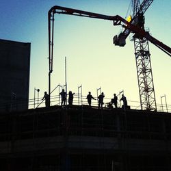Low angle view of people against sky