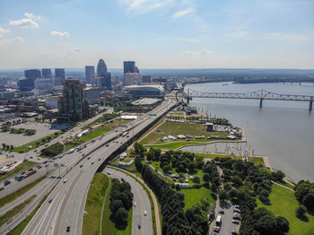 High angle view of road by buildings against sky