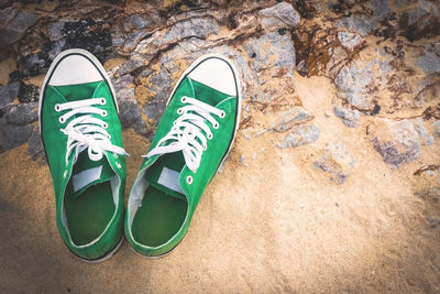 High angle view of shoes on sand