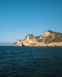 Scenic view of sea against clear blue sky